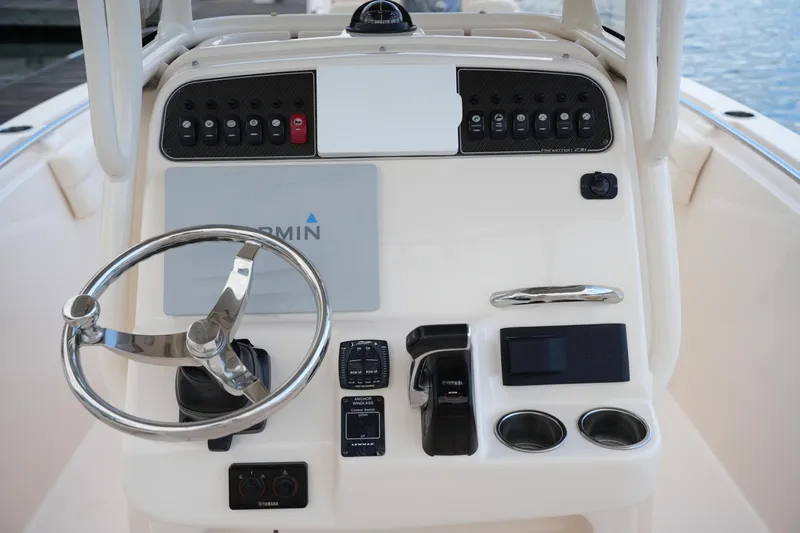 Slide: The Image of 2020 Grady-White Fisherman 236 boat console with steering wheel and control panel. - 25