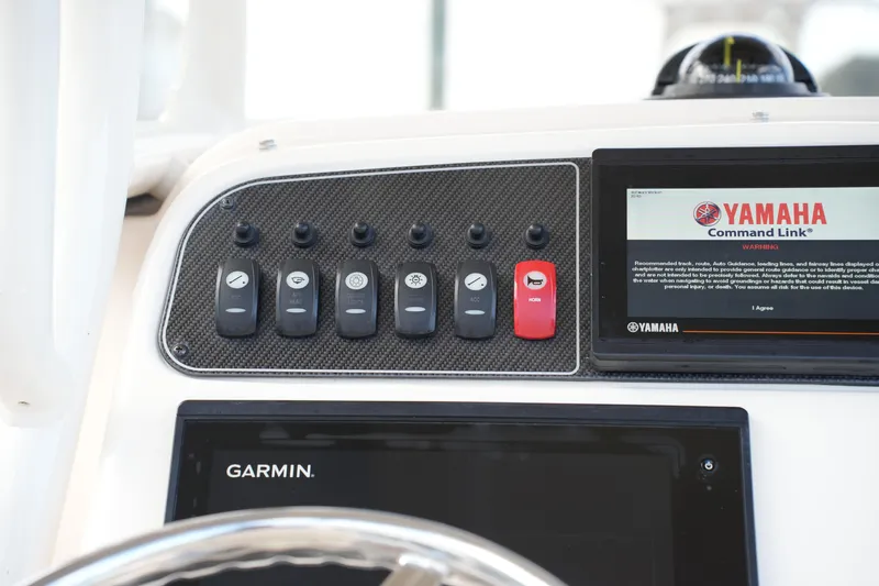 Slide: The Image of Control panel of 2020 Grady-White Fisherman 236 with Yamaha Command Link and Garmin display. - 28