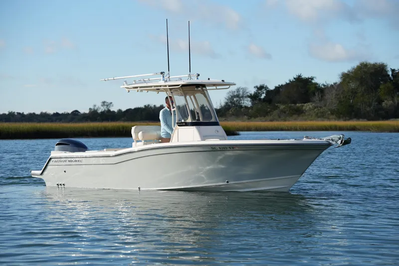 Slide: The Image of 2020 Grady-White Fisherman 236 boat on calm water, clear sky background. - 3