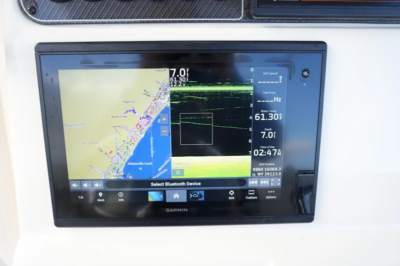 Slide: The Image of Garmin navigation display on 2020 Grady-White Fisherman 236 boat, showing map and sonar data. - 33