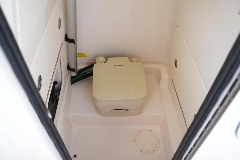 Slide: The Image of 2020 Grady-White Fisherman 236 boat interior with portable toilet. - 34