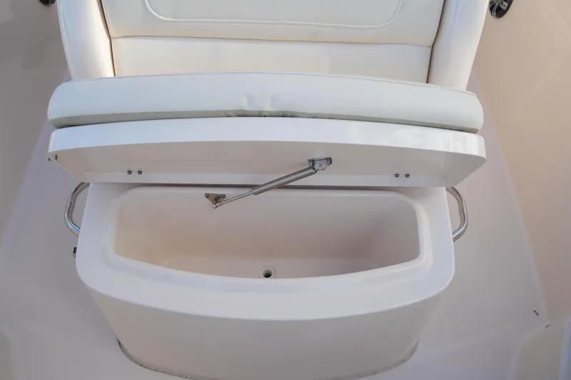 Slide: The Image of 2020 Grady-White Fisherman 236 boat seat with storage compartment open. - 37