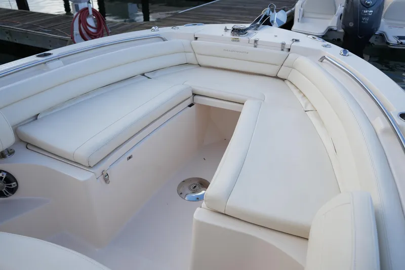 Slide: The Image of 2020 Grady-White Fisherman 236 boat interior with white cushioned seating. - 38
