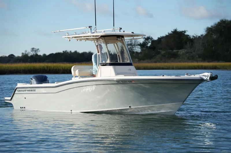 Slide: The Image of 2020 Grady-White Fisherman 236 boat on calm water, clear sky background. - 4
