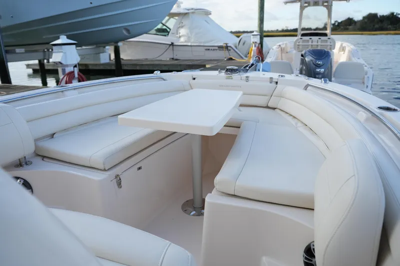 Slide: The Image of 2020 Grady-White Fisherman 236 boat interior with white seating and table. - 40