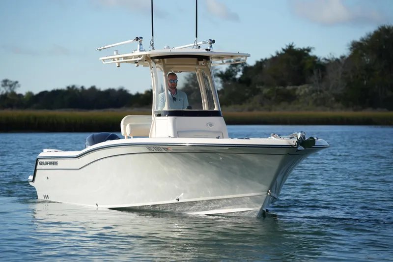 Slide: The Image of 2020 Grady-White Fisherman 236 boat cruising on calm water. - 5