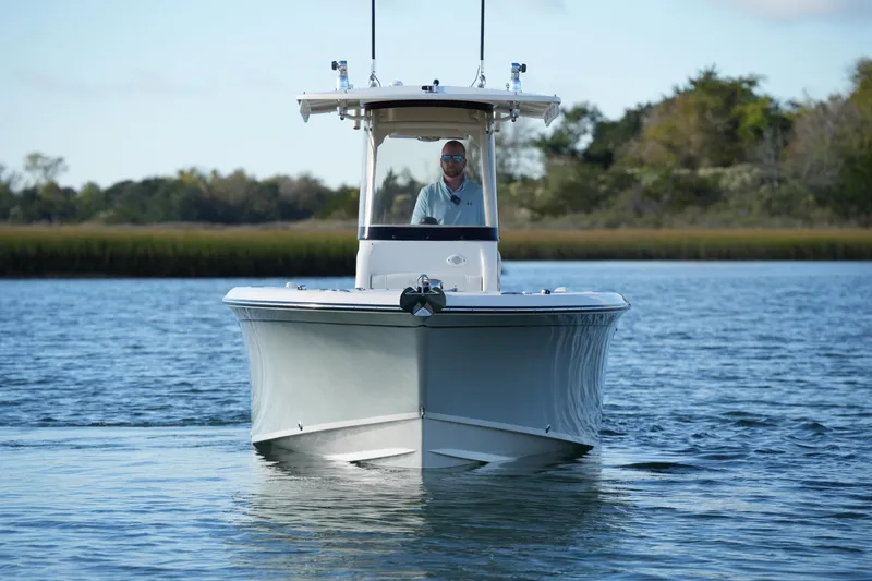Slide: The Image of 2020 Grady-White Fisherman 236 boat cruising on calm water with scenic background. - 7