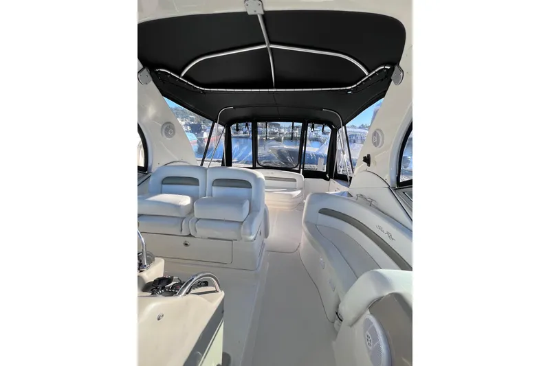 Slide: The Image of Interior of 2006 Sea Ray 320 Sundancer boat with seating and canopy. - 13
