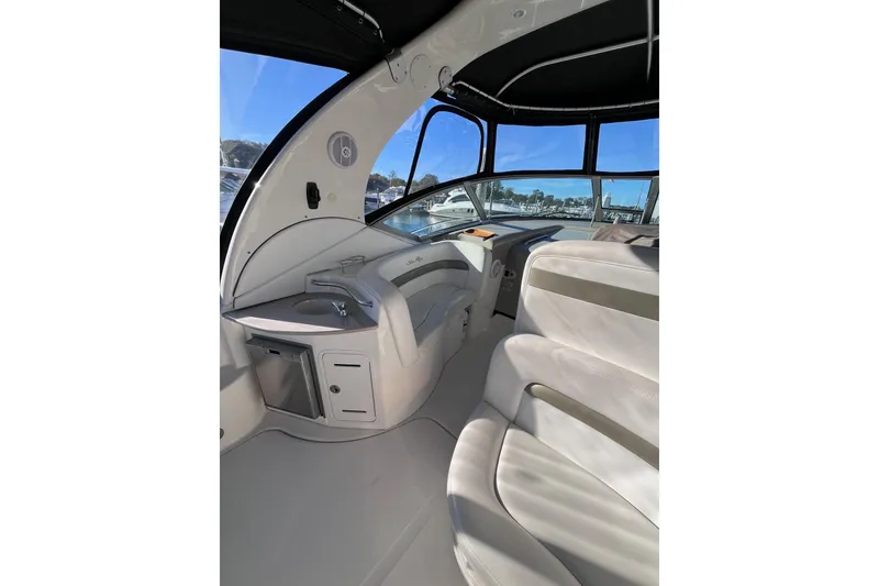 Slide: The Image of Interior of 2006 Sea Ray 320 Sundancer boat with seating and helm. - 8