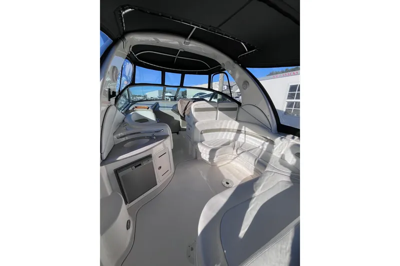Slide: The Image of Interior of 2006 Sea Ray 320 Sundancer boat with seating and helm. - 9