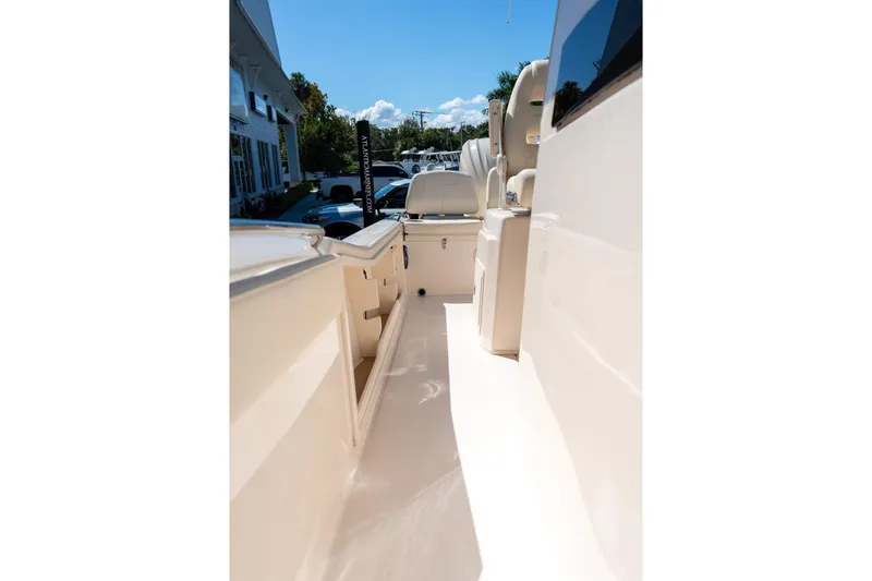 Slide: The Image of 2026 Grady-White 281 Coastal Explorer boat interior, showcasing sleek design and seating. - 12