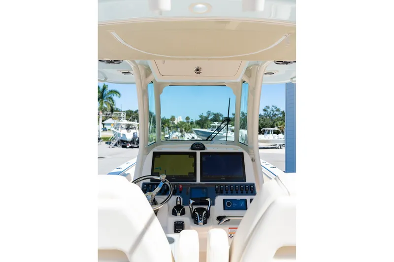 Slide: The Image of Interior view of 2026 Grady-White 281 Coastal Explorer boat cockpit with modern controls. - 15