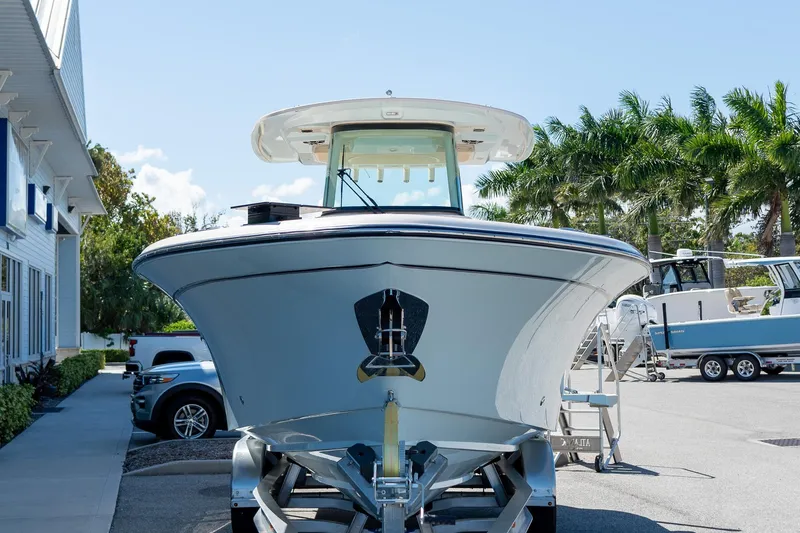 Slide: The Image of 2026 Grady-White 281 Coastal Explorer boat on trailer, parked outdoors. - 20