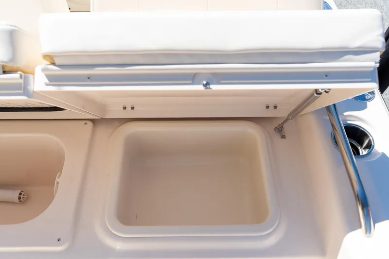 Slide: The Image of 2026 Grady-White 281 Coastal Explorer boat storage compartment with open lid. - 23