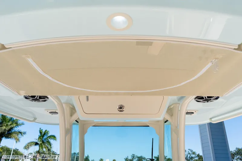 Slide: The Image of 2026 Grady-White 281 Coastal Explorer boat interior ceiling with speakers and lighting. - 27
