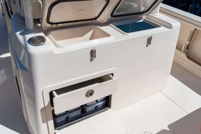 Slide: The Image of 2026 Grady-White 281 Coastal Explorer boat storage compartments and drawers. - 29