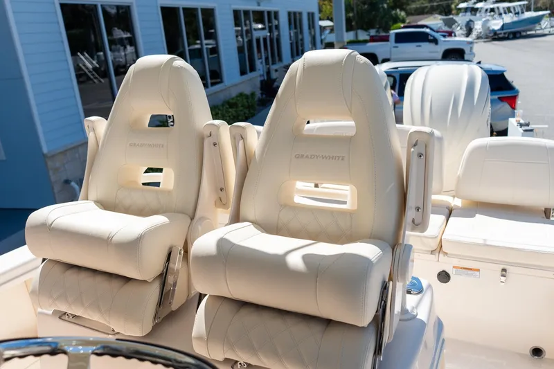 Slide: The Image of 2026 Grady-White 281 Coastal Explorer boat seats, luxurious design, outdoor setting. - 32