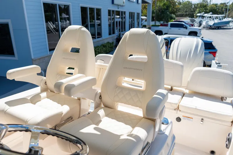 Slide: The Image of Luxury seating on 2026 Grady-White 281 Coastal Explorer boat, featuring plush white upholstery. - 33