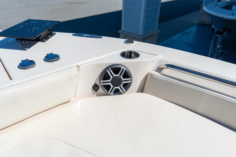 Slide: The Image of 2026 Grady-White 281 Coastal Explorer boat interior with speaker and cup holder. - 43