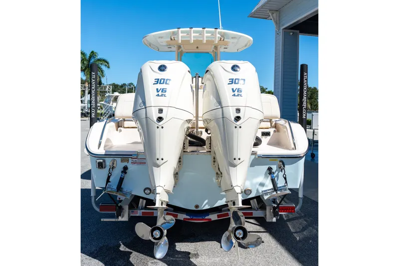 Slide: The Image of 2026 Grady-White 281 Coastal Explorer with twin 300 V6 outboard engines, rear view. - 5