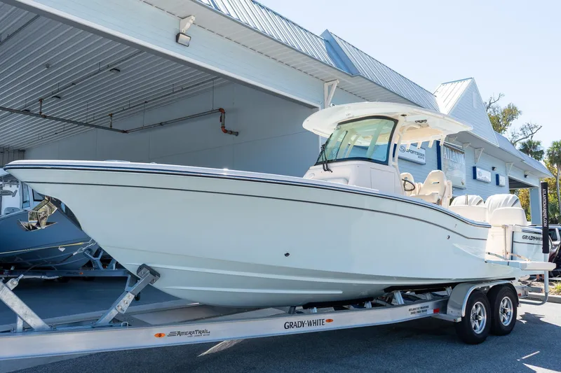 Slide: The Image of 2026 Grady-White 281 Coastal Explorer boat on trailer at dealership. - 8