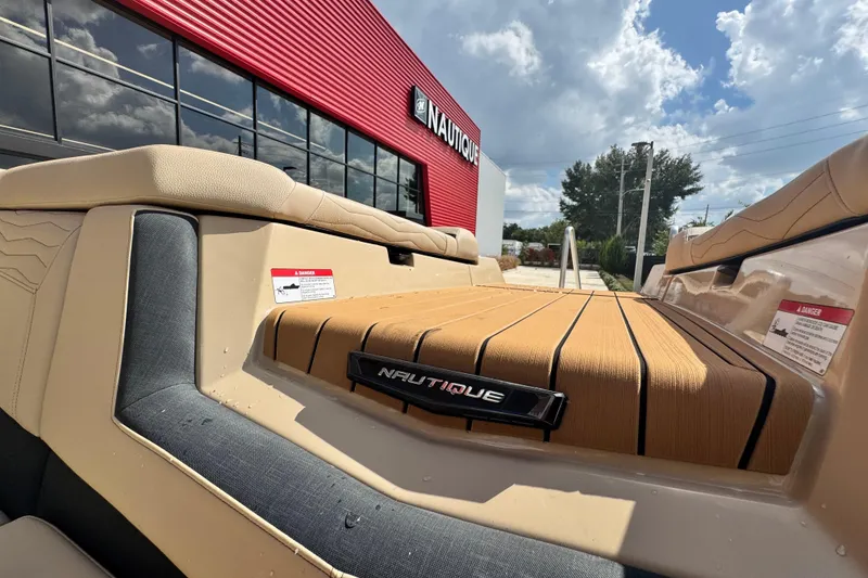 Slide: The Image of 2026 Nautique Super Air Nautique G23 Paragon boat at dealership, sunny day. - 5