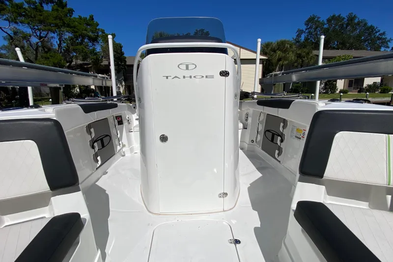 Slide: The Image of 2021 Tahoe 2150 CC boat interior with seating and storage compartments. - 11