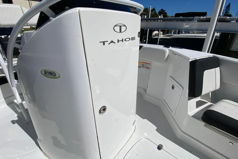 Slide: The Image of 2021 Tahoe 2150 CC boat interior with seating and console details. - 13