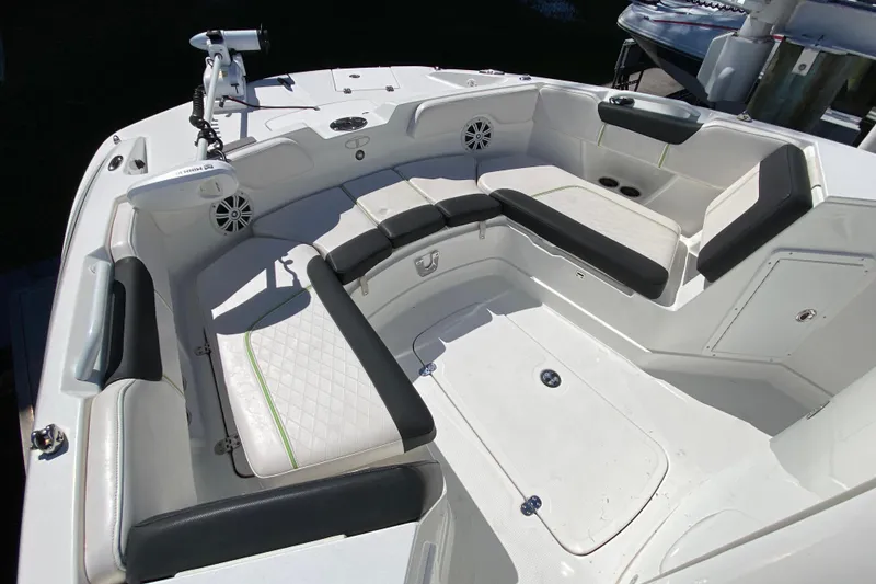 Slide: The Image of 2021 Tahoe 2150 CC boat interior with cushioned seating and modern design. - 20