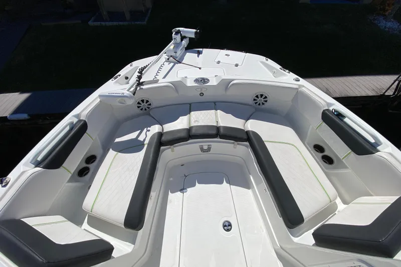 Slide: The Image of 2021 Tahoe 2150 CC boat interior with seating and fishing equipment. - 23