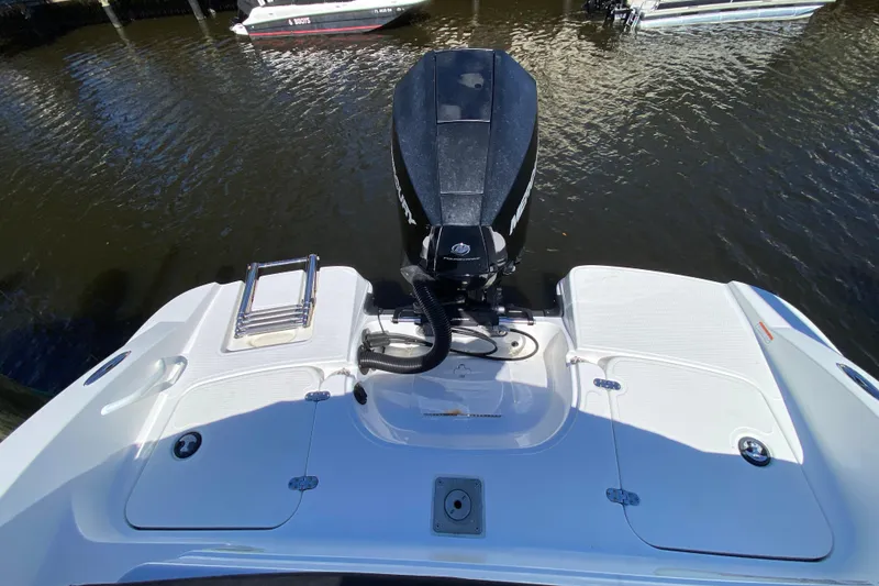 Slide: The Image of 2021 Tahoe 2150 CC boat with outboard motor on water. - 40