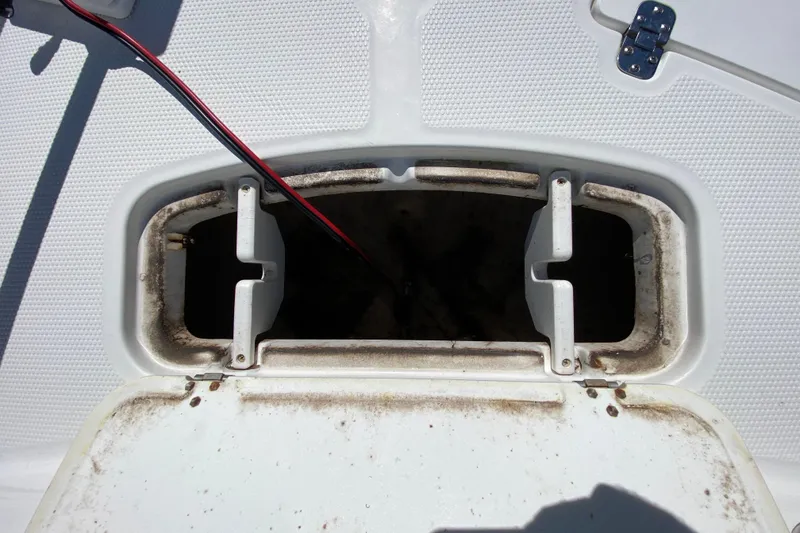 Slide: The Image of Open storage compartment on 2021 Tahoe 2150 CC boat deck. - 56