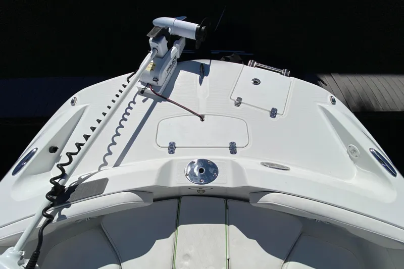 Slide: The Image of 2021 Tahoe 2150 CC boat deck with trolling motor and storage compartments. - 57