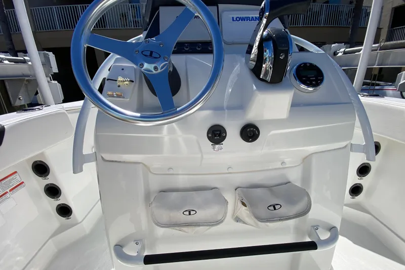 Slide: The Image of 2021 Tahoe 2150 CC boat console with steering wheel and controls. - 8