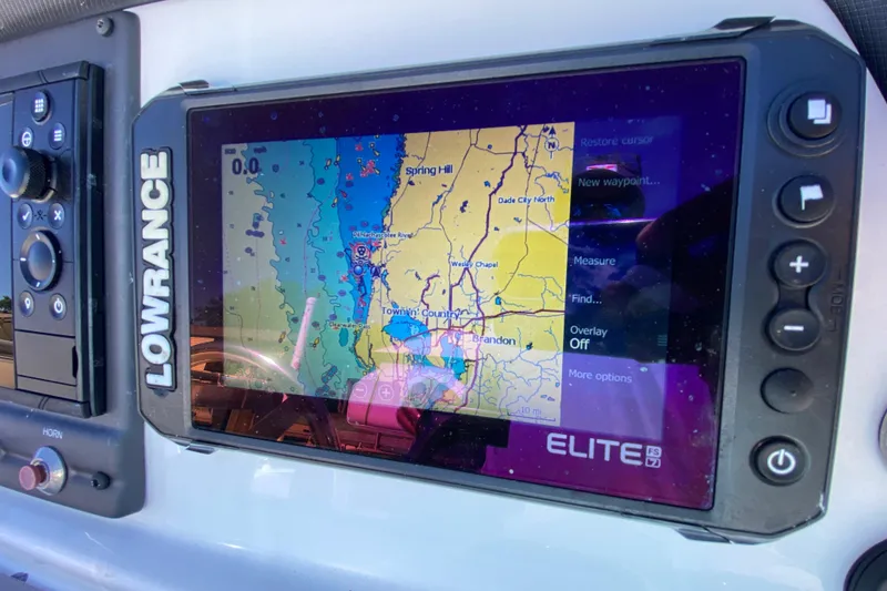 Slide: The Image of Lowrance Elite FS7 GPS display on 2021 Tahoe 2150 CC boat dashboard. - 9