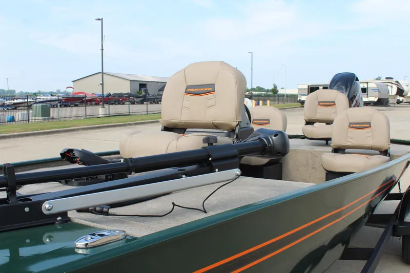 Slide: The Image of 2026 Tracker Bass Tracker Classic Limited boat with beige seats and trolling motor. - 11
