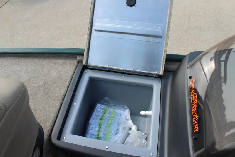 Slide: The Image of Open storage compartment in 2026 Tracker Bass Tracker Classic Limited boat. - 13