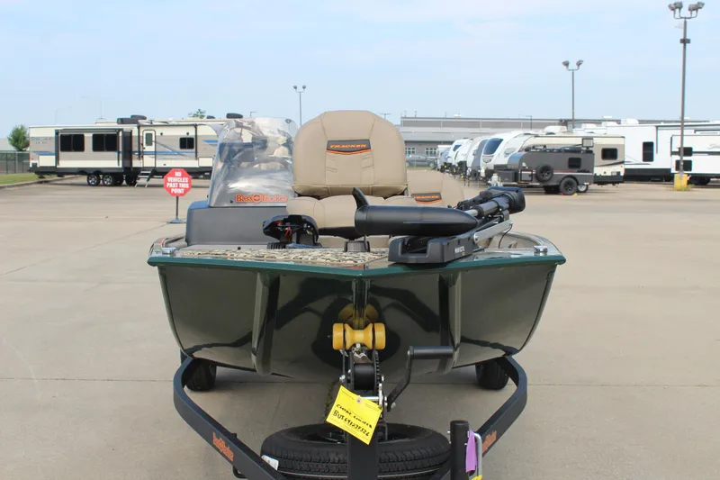 Slide: The Image of 2026 Tracker Bass Tracker Classic Limited boat on trailer in parking lot. - 2