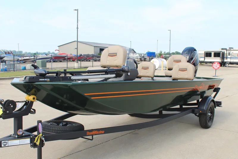 Slide: The Image of 2026 Tracker Bass Tracker Classic Limited boat on trailer, parked outdoors. - 3