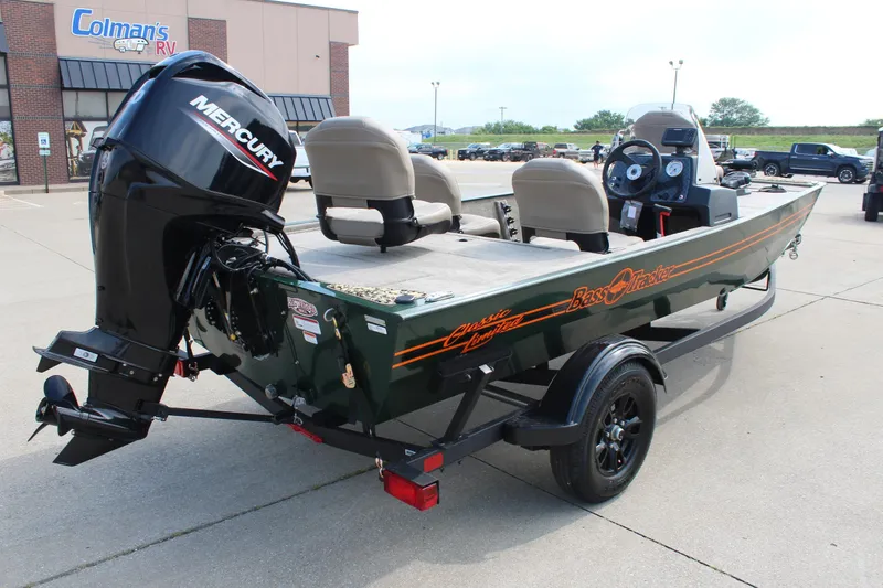 Slide: The Image of 2026 Tracker Bass Tracker Classic Limited boat with Mercury engine at dealership. - 6