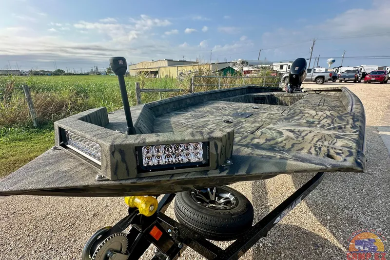 The Image of 2026 SeaArk 1752 Slayer X Pro boat with camouflage design and LED lights. - 0