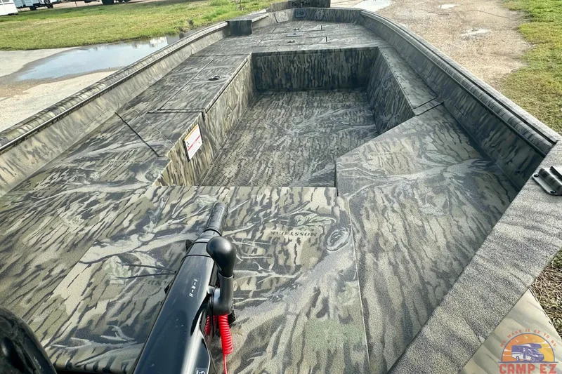 Slide: The Image of 2026 SeaArk 1752 Slayer X Pro boat with camouflage interior design. - 10