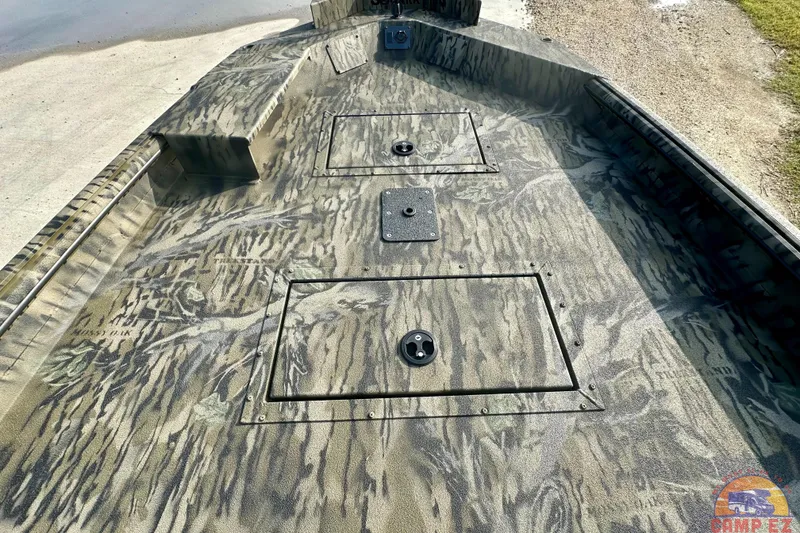 Slide: The Image of 2026 SeaArk 1752 Slayer X Pro boat with camouflage deck design. - 17