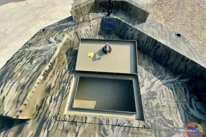 Slide: The Image of 2026 SeaArk 1752 Slayer X Pro boat with camo design and storage compartments. - 19