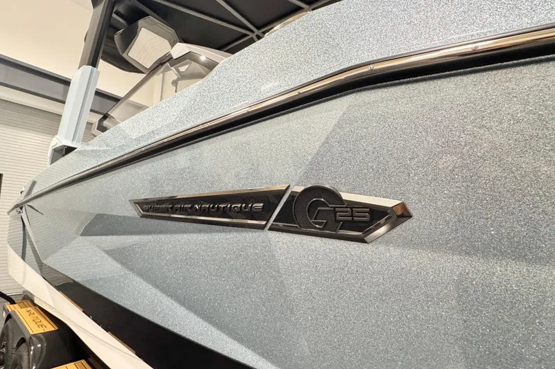 Slide: The Image of 2026 Nautique Super Air Nautique G23 Paragon boat, sleek design, close-up view. - 8