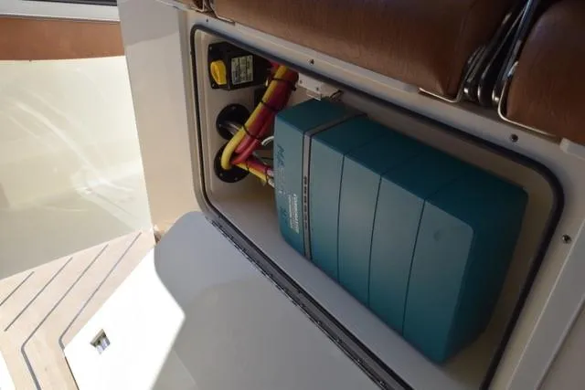 Slide: The Image of 2023 Scout 377 LXF electrical compartment with wiring and battery system. - 20