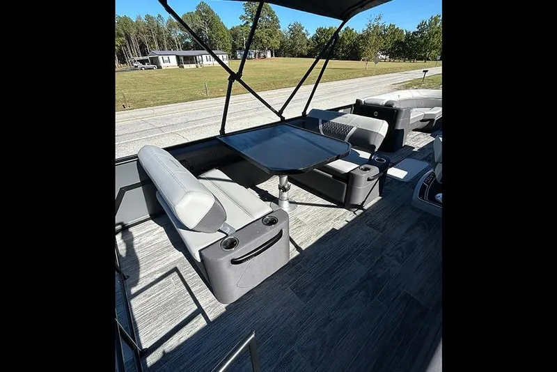 Slide: The Image of Interior of 2025 Viaggio Z22D boat with modern seating and table setup. - 10