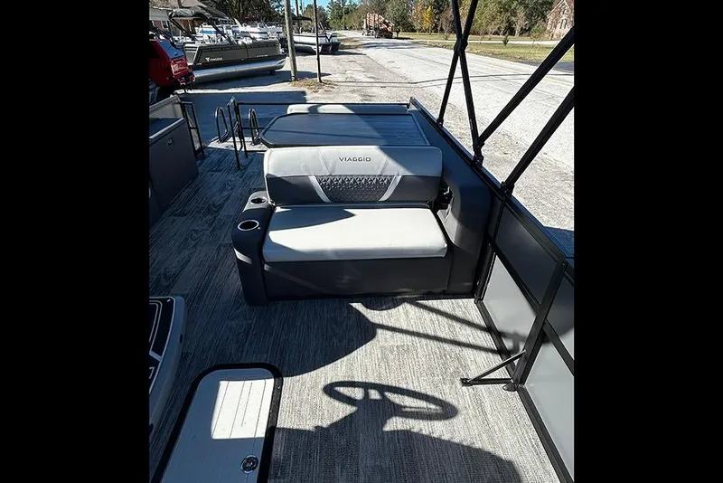 Slide: The Image of 2025 Viaggio Z22D boat interior with seating and cup holders, showcasing modern design. - 12