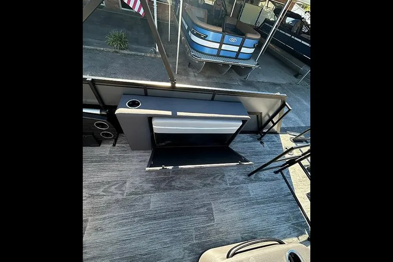 Slide: The Image of 2025 Viaggio Z22D boat interior with foldable seating and storage compartment. - 18