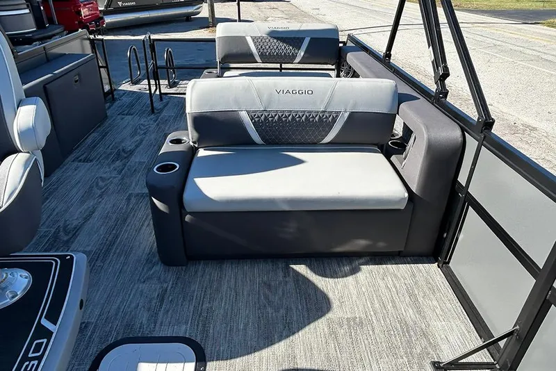 Slide: The Image of 2025 Viaggio Z22D boat interior with gray seating and cup holders. - 19
